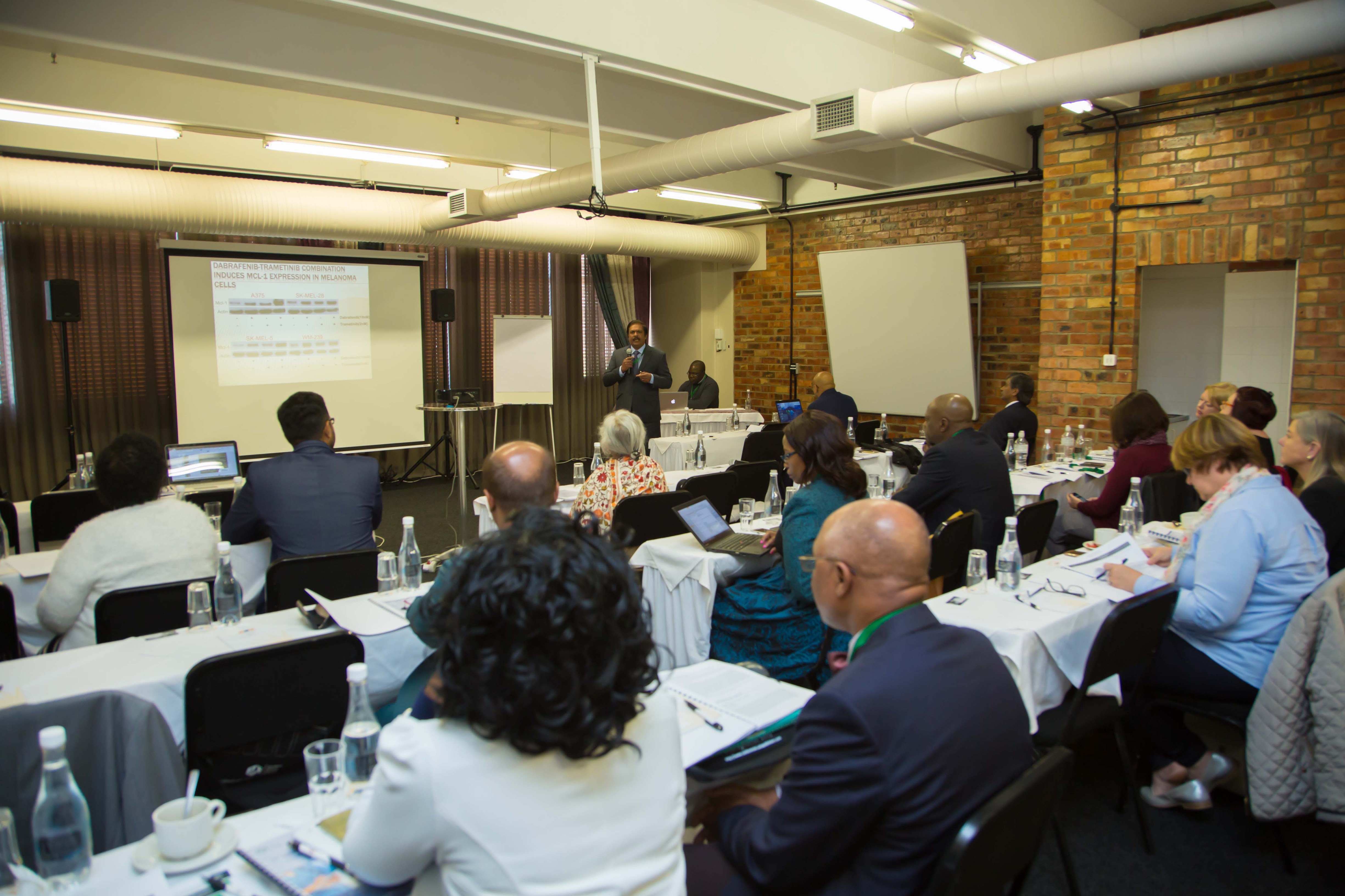 Researchers attending a scientific presentation